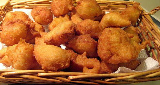 Delicious golden-fried ZZIPPULI served in a rustic wicker basket.