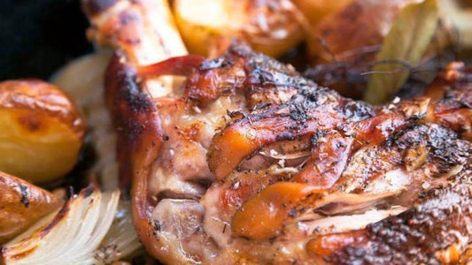 Deliciously roasted lamb leg served with golden potatoes and aromatic onions.