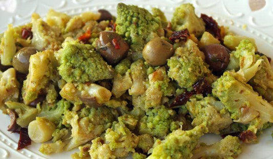 Delectable broccoli ffucati alla Calabrese, a vibrant dish with olives and sun-dried tomatoes.