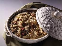 Delicious Riso alla Genovese served in a traditional dish, showcasing rice with vegetables and meats.