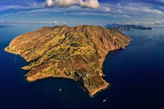 Aerial view of Vulcano Island, part of the Aeolian Islands, showcasing lush landscapes and surrounding waters.