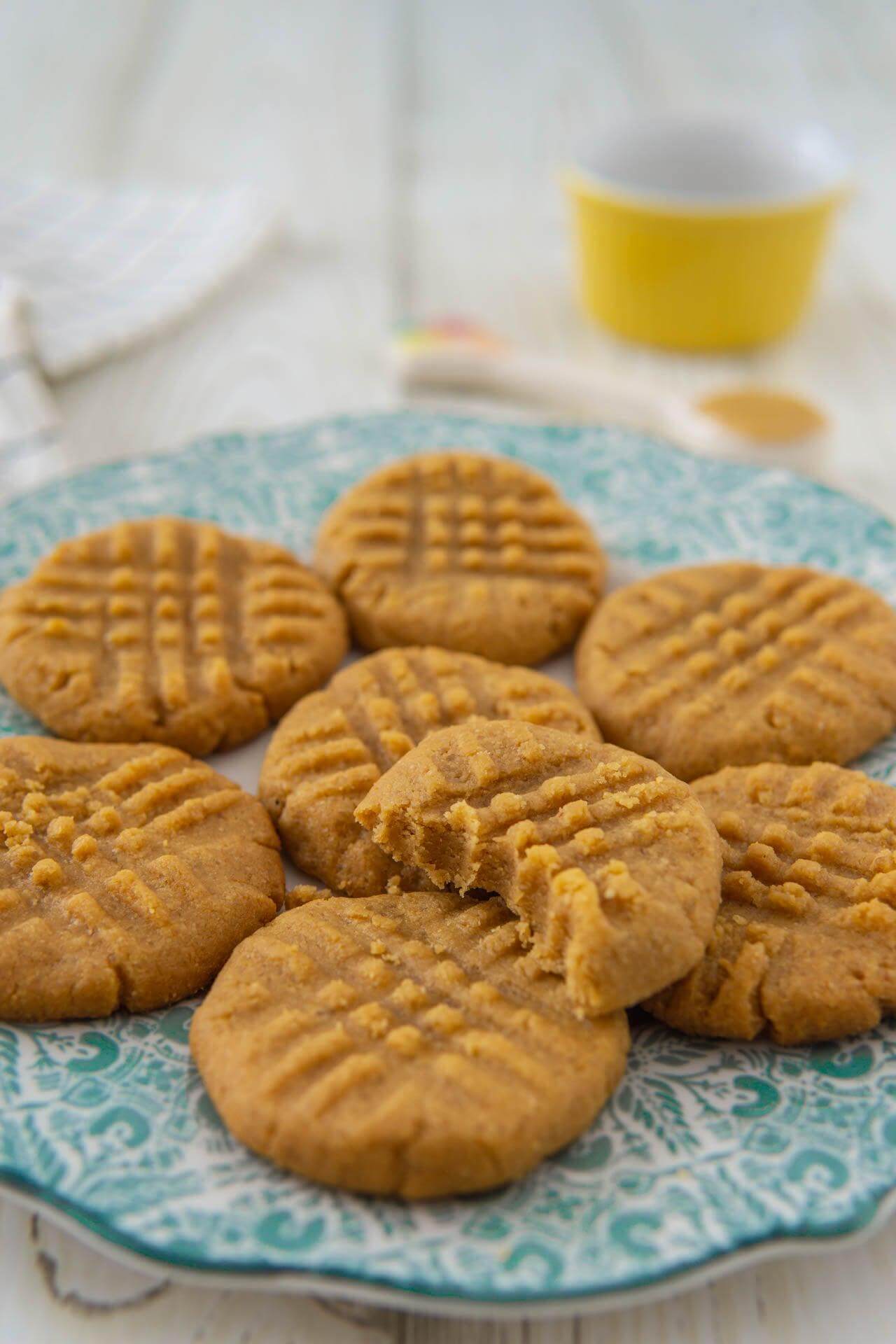 Delicious homemade peanut butter cookies on a decorative plate, showcasing crispy texture and rich flavor.