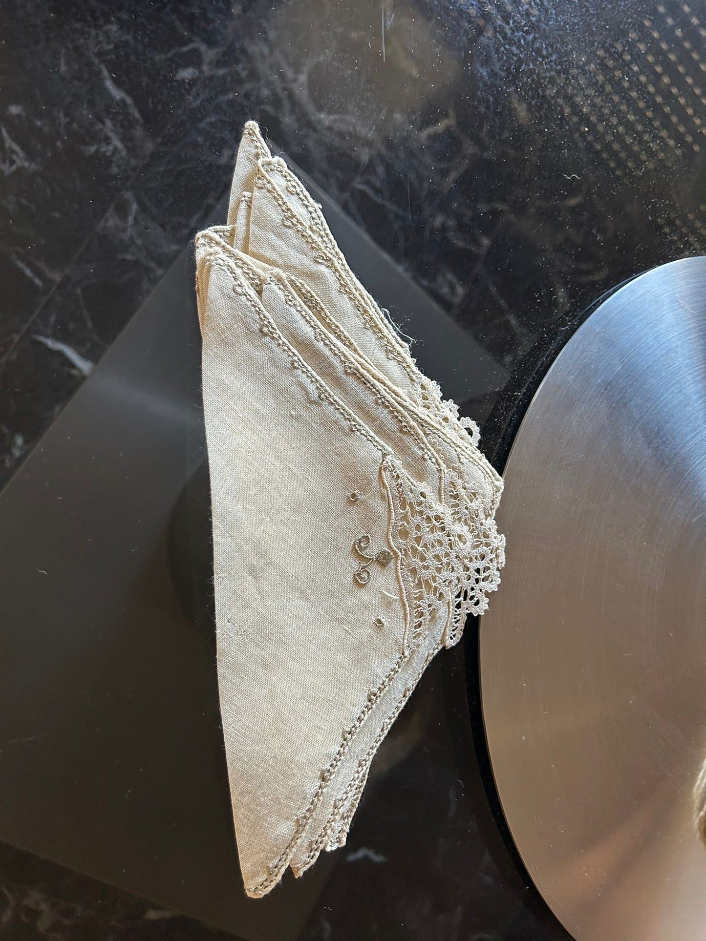 Elegant Burano lace napkins, handcrafted, perfect for special events, showcasing intricate details and vintage charm.
