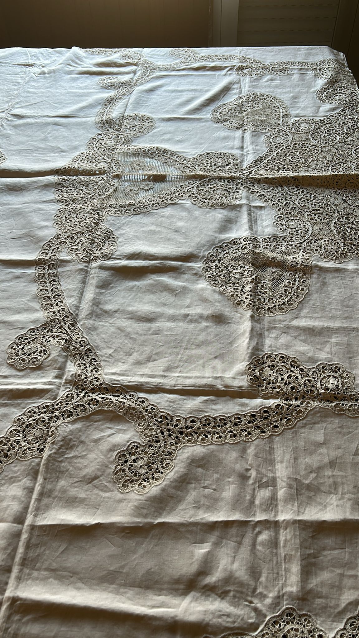 Antique Burano lace linen bedspread showcasing intricate embroidery, original 1950s handmade piece from Italy.
