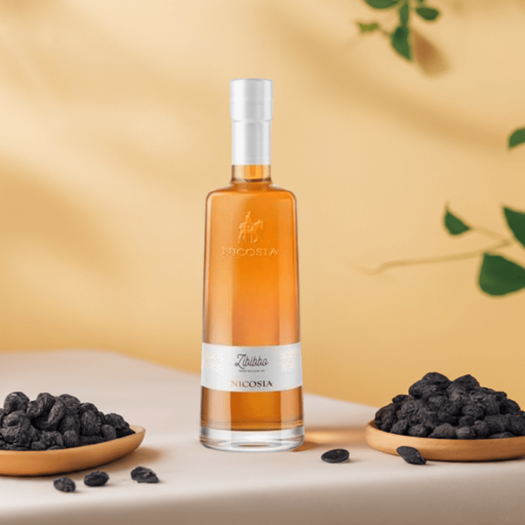 Vino Passito Liquoroso Zibibbo IGT Cantina Nicosia bottle with dark dried fruits on a table.