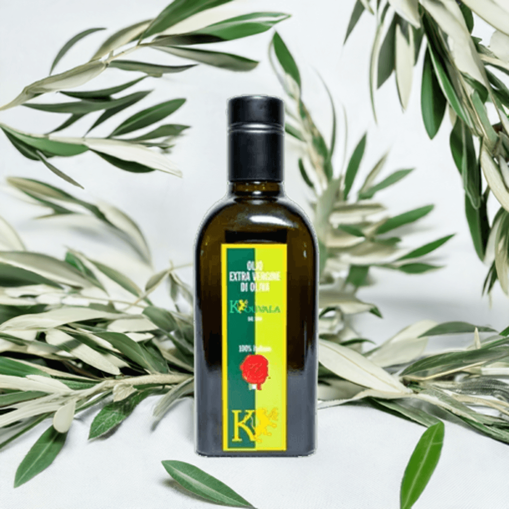 Bottle of Olio Biologico Extravergine di Oliva 100% Italiano surrounded by olive leaves.