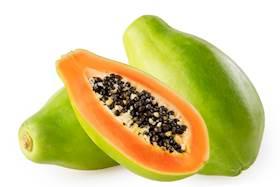 Papaya fruit cut in half, showcasing sweet orange flesh and black seeds, cultivated in Calabria, Italy.