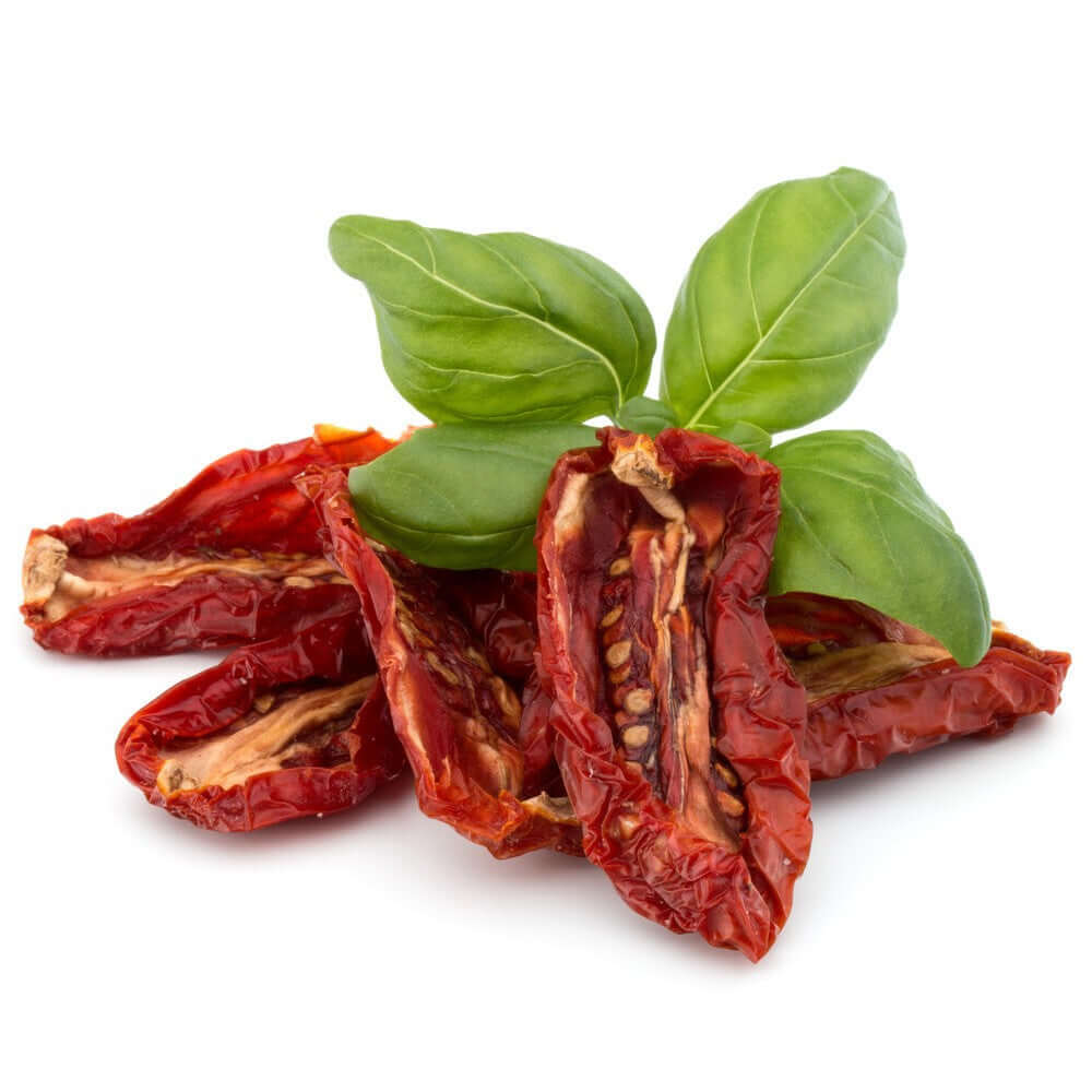 Dried Italian tomatoes from Puglia with fresh basil, showcasing their vibrant color and rich texture.