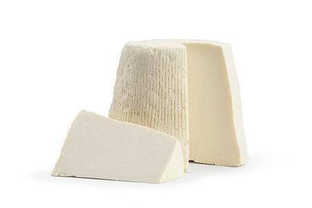 Ricotta Stagionata Salata blocks showing the traditional salted cheese made from sheep's milk.