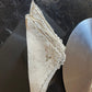 Elegant Burano lace napkins, handcrafted, perfect for special events, showcasing intricate details and vintage charm.