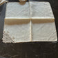 Antique Burano table napkin with lace trim, handcrafted in Italy, perfect for special events or elegant dining.