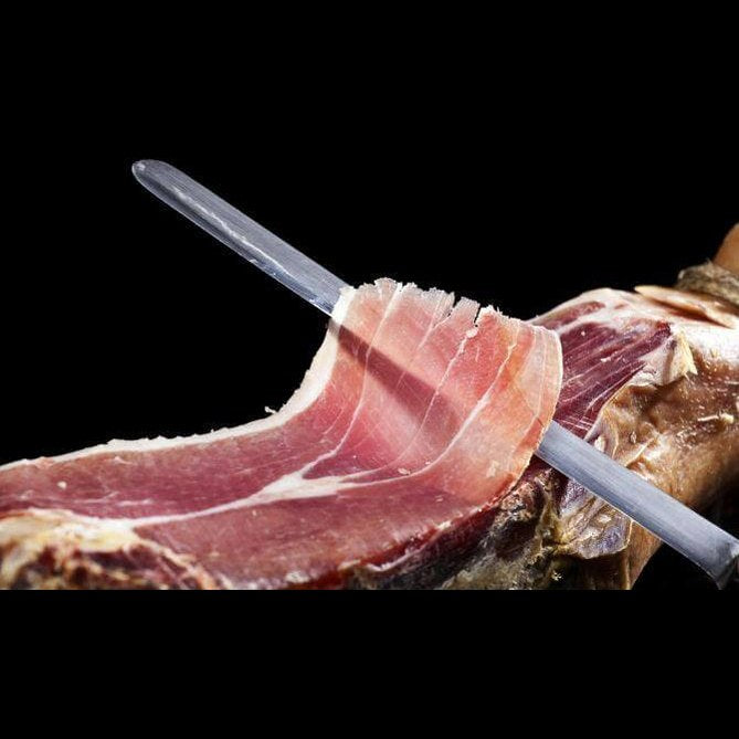 Prosciutto Crudo Calabrese sliced for serving, showcasing its rich color and texture, ideal for antipasti.